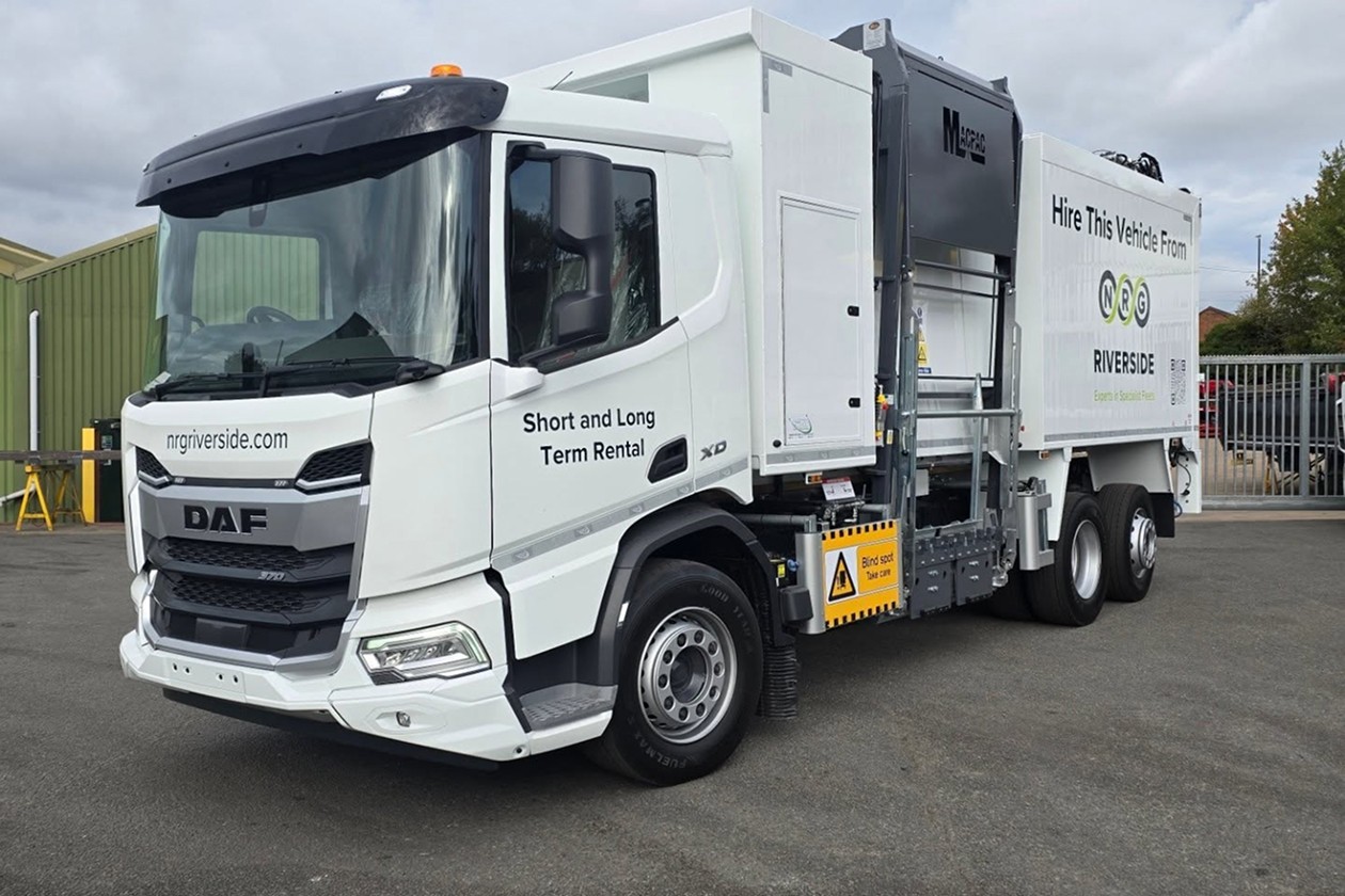 A DAF truck with a specialized body for vehicle rental, parked on a lot.